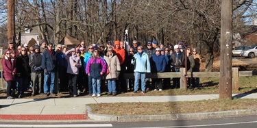 people hiking outside and posing for photo